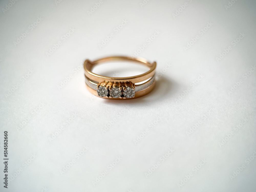 Gold diamond ring on a white isolated background. Red Gold Ring Gold diamond ring on a white isolated background. Red Gold Ring