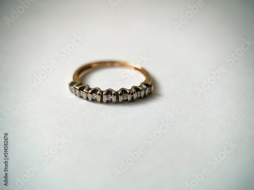 Gold diamond ring on a white isolated background. Red Gold Ring