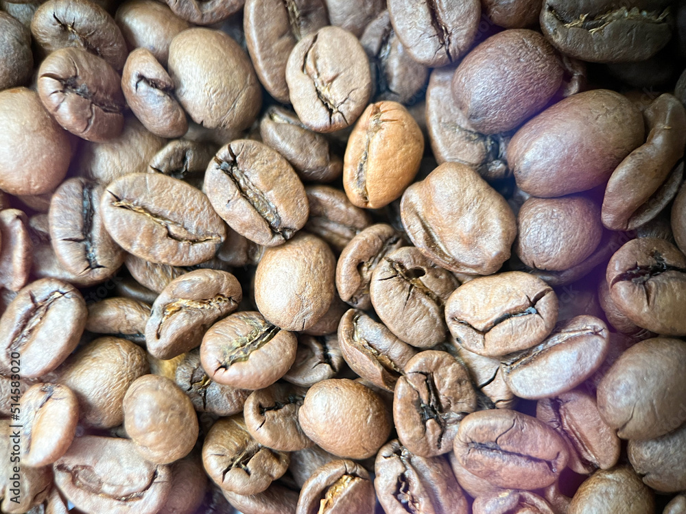 Coffee bean background close-up. Coffee beans in macro. Arabica coffee beans Coffee bean background close-up. Coffee beans in macro. Arabica coffee beans