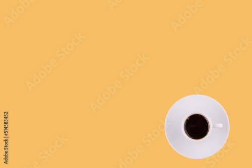 classic cup of americano coffee on a yellow background. Space for text
