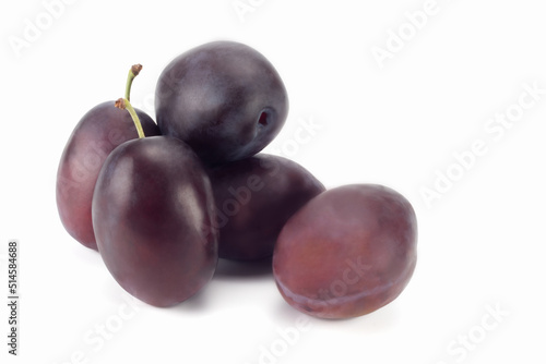 A few fresh plums isolated on bright background. Close up view.