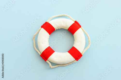 Top view image of lifebuoy over blue background photo