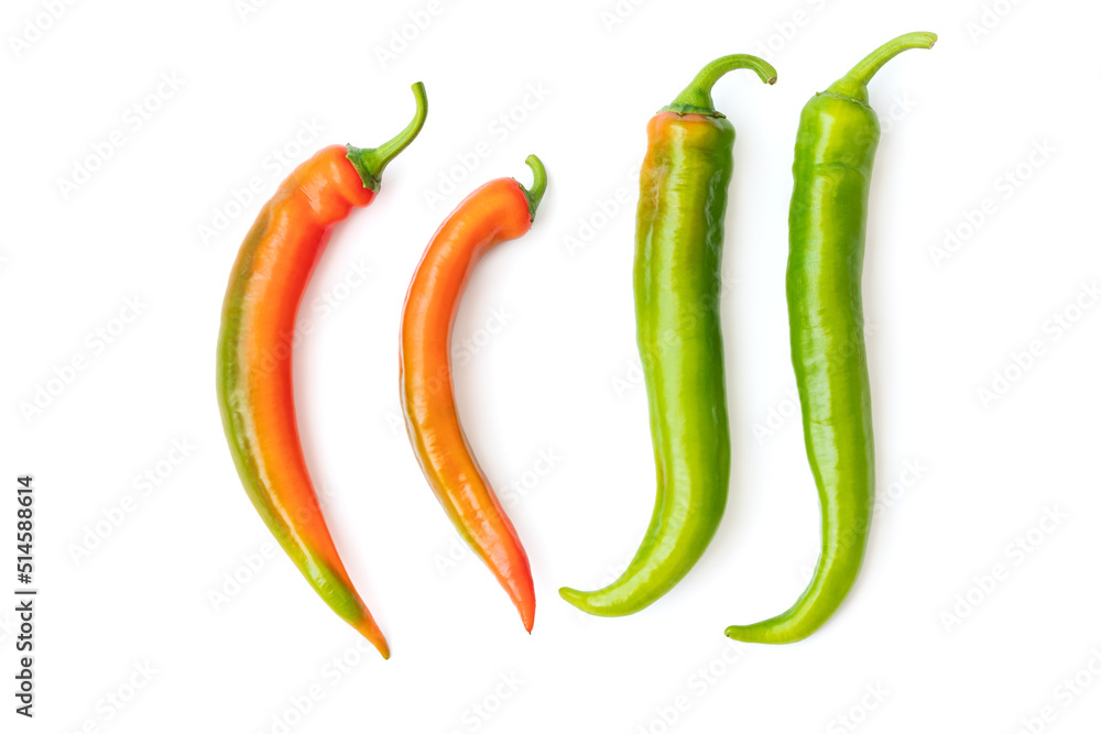 A group of delicious red and green hot and tasty peppers with shiny skins isolated with clipping path on a white background. Spicy ingredients and flavoring A group of delicious red and green hot and tasty peppers with shiny skins isolated with clipping path on a white background. Spicy ingredients and flavoring