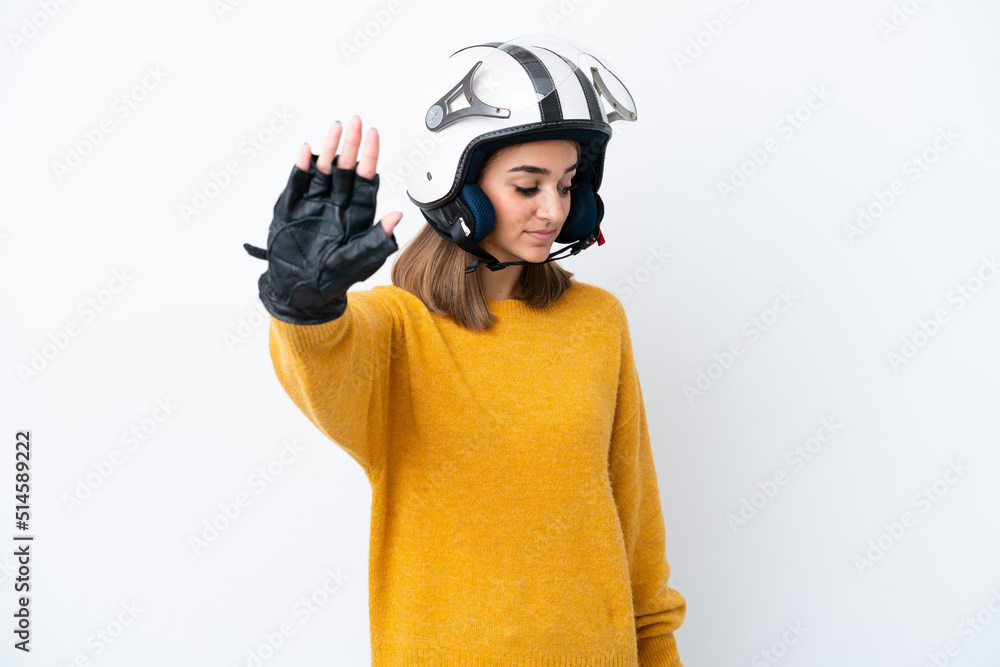 Young caucasian woman with a motorcycle helmet isolated on white background making stop gesture and disappointed Young caucasian woman with a motorcycle helmet isolated on white background making stop gesture and disappointed