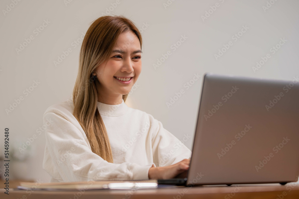 Asian girl using computer laptop playing game and social media or chatting with her friends. Asian girl using computer laptop playing game and social media or chatting with her friends.