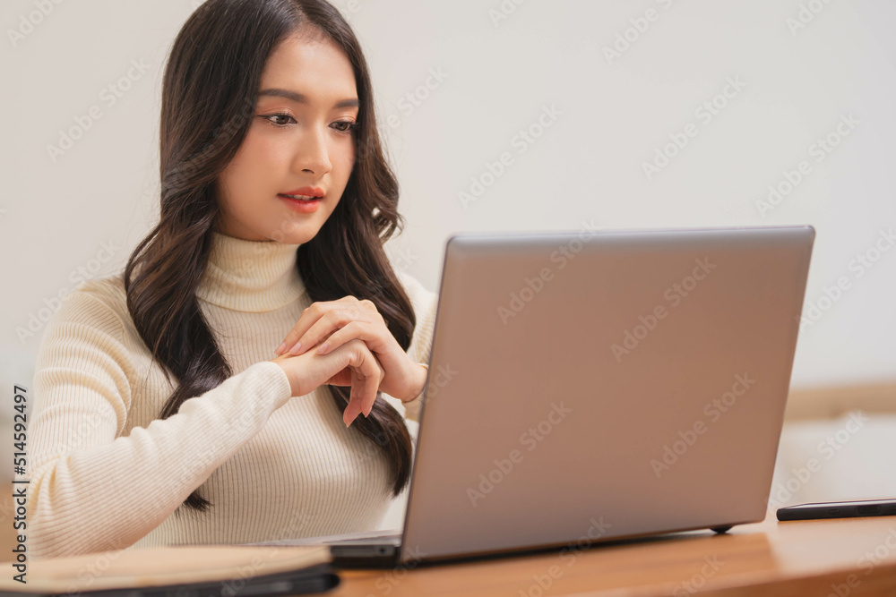 Asian girl using computer laptop playing game and social media or chatting with her friends. Asian girl using computer laptop playing game and social media or chatting with her friends.