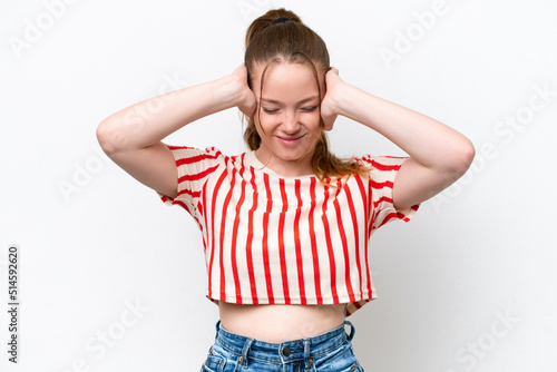 Young caucasian girl isolated on white background frustrated and covering ears