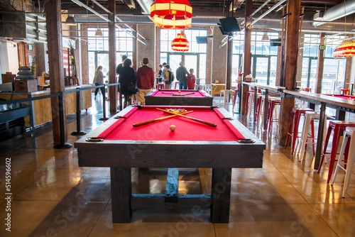 table with balls and cue in bar, Petco Park, San Diego, California, USA photo