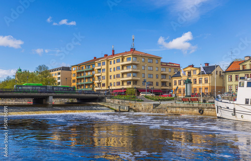 Beautiful view of central part of city of Uppsala with river and bridge on sunny summer day. Sweden. photo