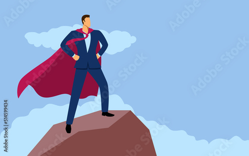 Businessman as a superhero standing on top of a mountain