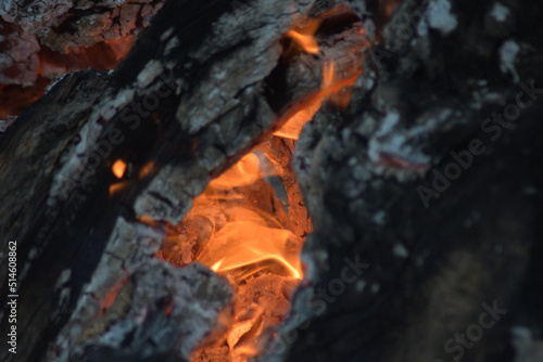 Fire inside a wooden log burning photo