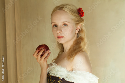 Romantic vintage woman with red apple photo