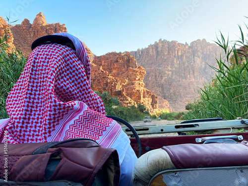 Saudi guide helping tourist to explore the Wadi Disah, from the sustainable future city of Saudi Arabia called as NEOM