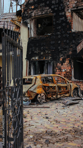 Obraz na płótnie Irpin, Kyiv Oblast, Ukraine: Atrocities of the Russian army in the suburbs of Kyiv. Irpin. Destroyed car near house of civilians destroyed by russian tanks. Russia's war against Ukraine. w salonie