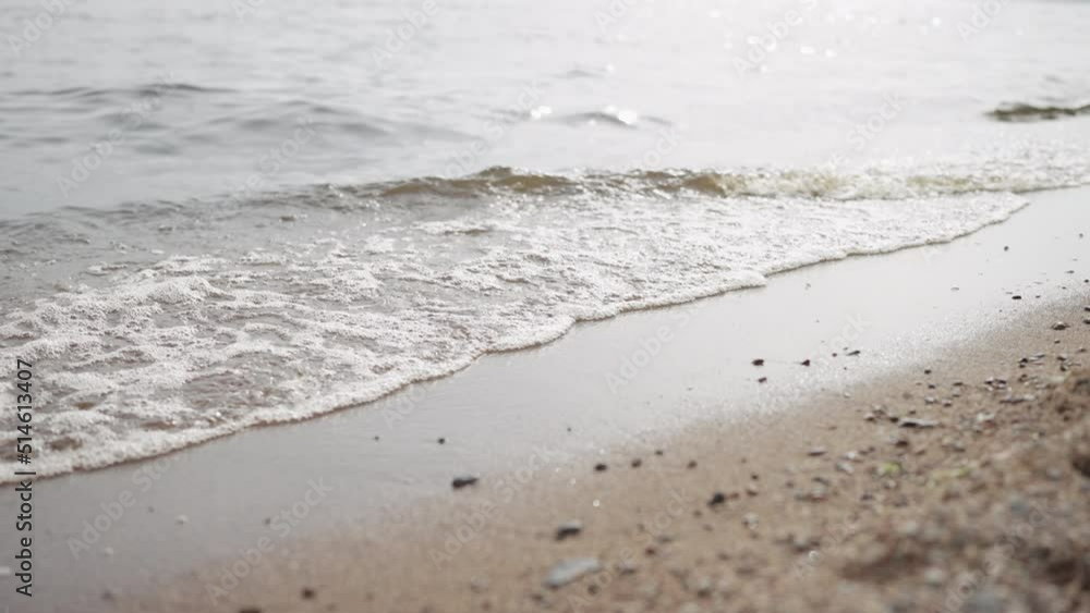 Slow motion closeup shot of waves rolling on a beach on Baltic Sea Slow motion closeup shot of waves rolling on a beach on Baltic Sea