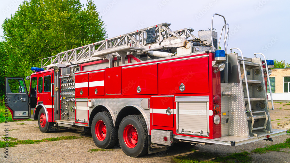 A fire truck with a retractable ladder for the delivery of firefighters ...