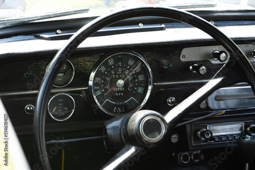 retro car dashboard interior. View of the steering wheel and dashboard of an old vintag car