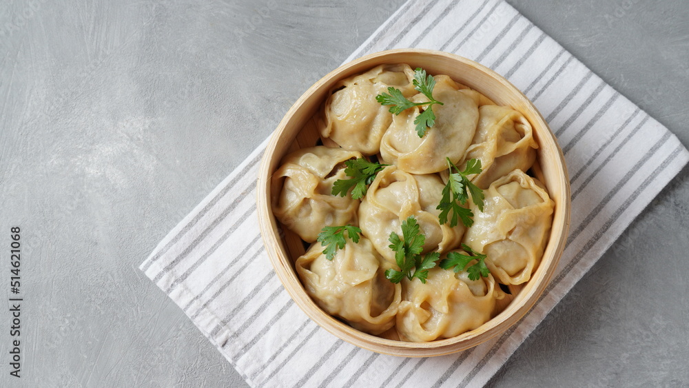 Manti, dumplings with minced meat wrapped in unleavened dough and cooked by steaming Manti, dumplings with minced meat wrapped in unleavened dough and cooked by steaming