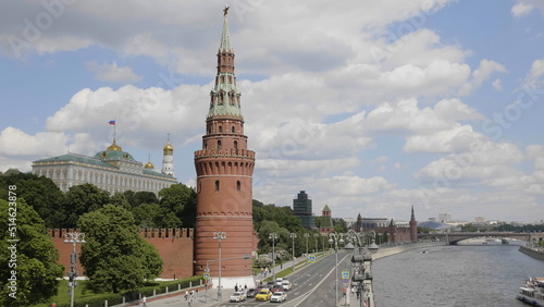 MOSCOW, RUSSIA - MAY 22, 2022: View of the Moscow Kremlin from the Moscow river. Red brick towers and Bell Tower Of Ivan The Great