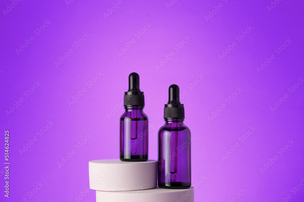 Beauty face serum in a glass dropper bottles on podium. Hyaluronic acid oil, serum with collagen and peptides skin care product.