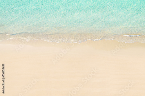 Top view of tropical Seychelles sand beach. Blue, turquoise transparent water surface of ocean, sea, lagoon. Horizontal background. Aerial, drone view