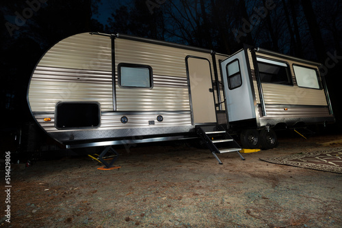 Long RV at night in a forest