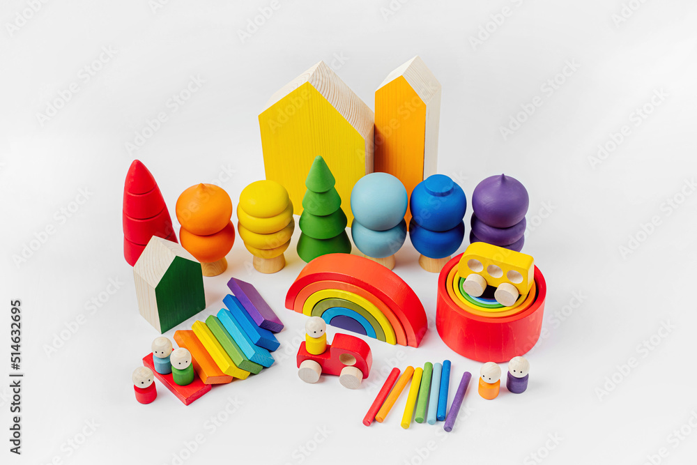 Colorful wooden toys. Houses, trees, toy cars and little men in the