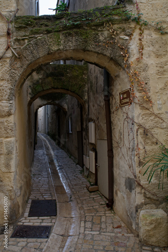 Narrow alley in the old town of Uzes photo