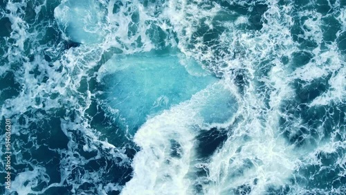 Iceberg huge chunks of blue Ice floating on the waves in the ocean beautiful arctic landscape aerial top view