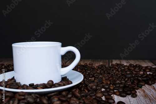 Cup of coffee on coffee beans background.