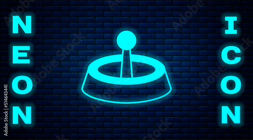 Glowing neon Casino roulette wheel icon isolated on brick wall background. Vector