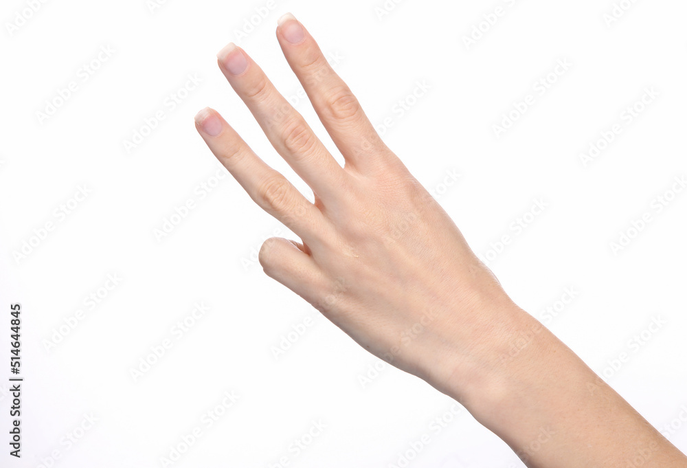 Female hand shows three fingers isolated on white background.