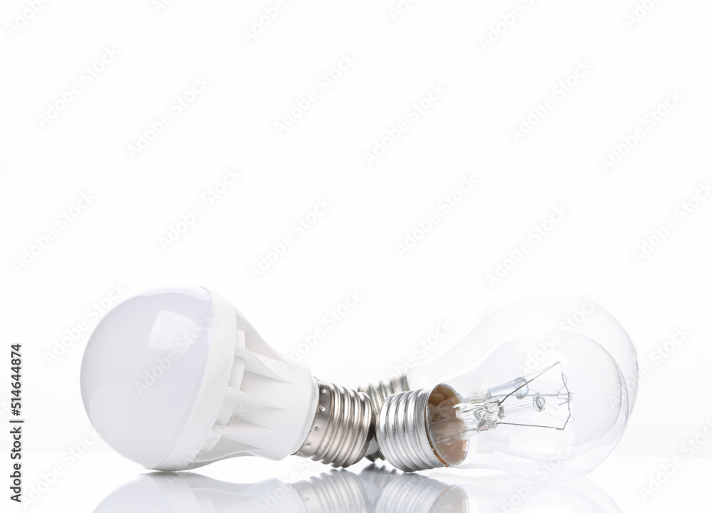Led and incandescent light bulb isolated on white background with reflection Led and incandescent light bulb isolated on white background with reflection