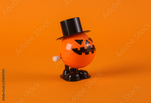 Obraz na plátně Clockwork halloween toy monster on orange background