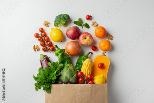 Delivery healthy food background. Healthy vegan vegetarian food in paper bag vegetables and fruits on white, copy space, banner. Shopping food supermarket and clean vegan eating concept
