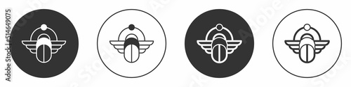 Black Egyptian Scarab icon isolated on white background. Winged scarab Beetle and sun. Circle button. Vector