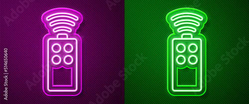 Glowing neon line Remote control for the camera icon isolated on purple and green background. An auxiliary device that allows you to work with a camera from a distance. Vector