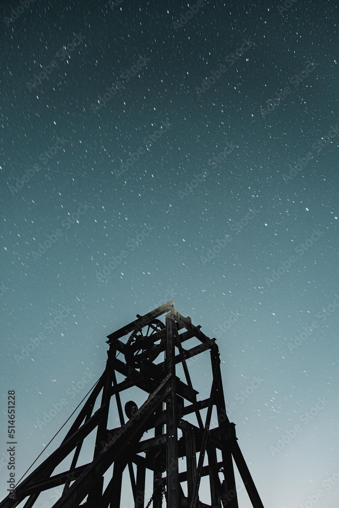 old structure with stars in the background