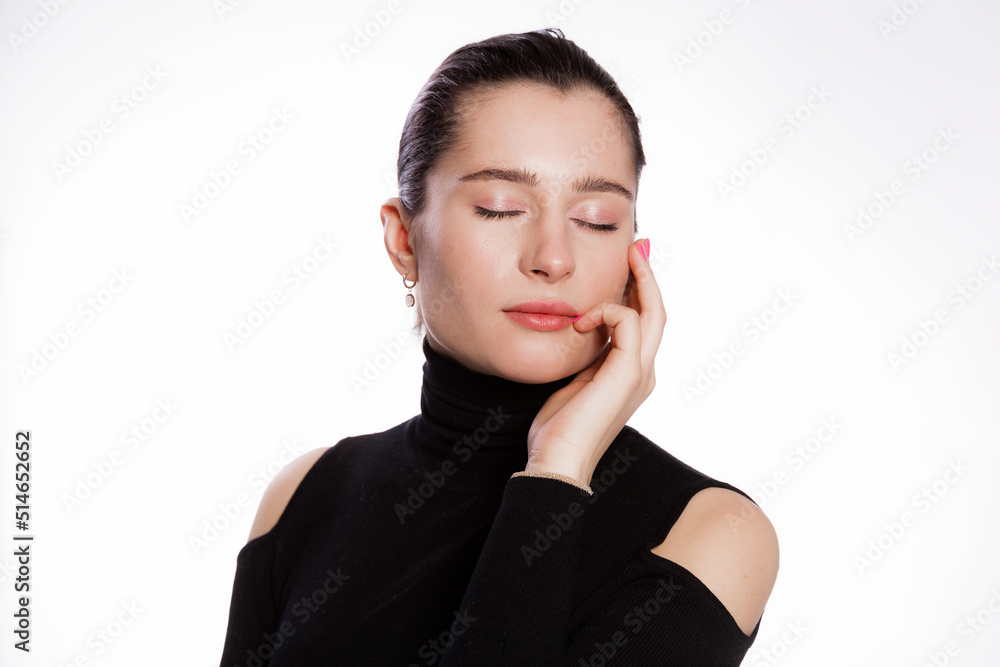 Woman with short hair and clean skin. Face close up, skin beauty tanned, beautiful smile woman in black turtleneck over white background Woman with short hair and clean skin. Face close up, skin beauty tanned, beautiful smile woman in black turtleneck over white background
