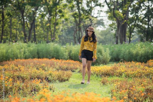 Asian girl in vintage dress enjoy walking in spring garden © Blanscape