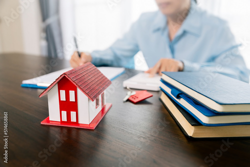 Real estate brokers or real estate agent with client or architect team Discussions about contracts , Saving money to invest in house or property in the future. Business property Concept.