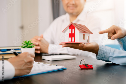 Real estate brokers or real estate agent with client or architect team Discussions about contracts , Saving money to invest in house or property in the future. Business property Concept.