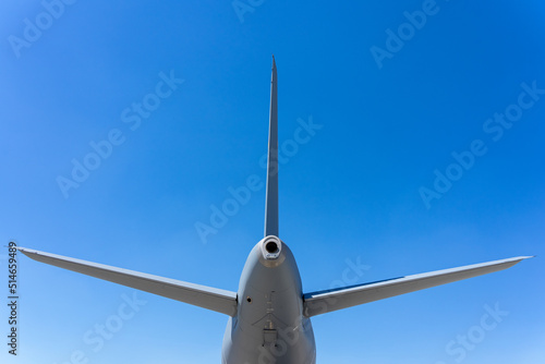 The empennage of the passenger aircraft against background of blue sky. photo