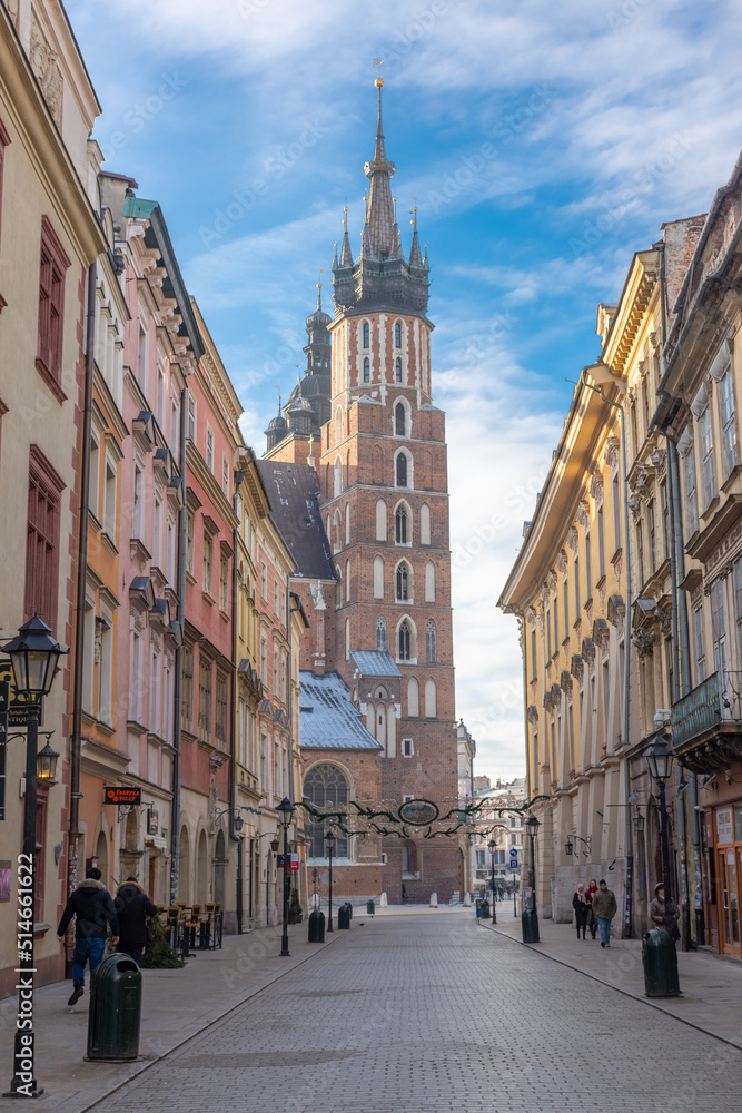 View of St. Mary Church from the main Florianska street in the old town of Krakow, Poland