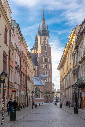 View of St. Mary Church from the main Florianska street in the old town of Krakow, Poland photo