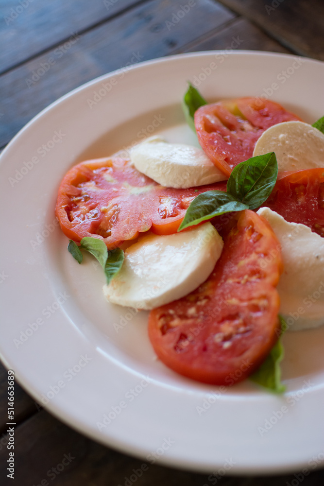Caprese salad. Tomatoes and mozzarella with basil Caprese salad. Tomatoes and mozzarella with basil