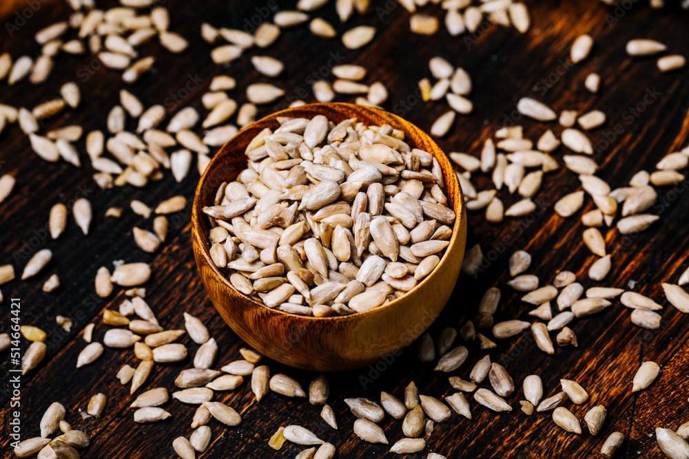 Sunflower seeds on a wooden table Sunflower seeds on a wooden table