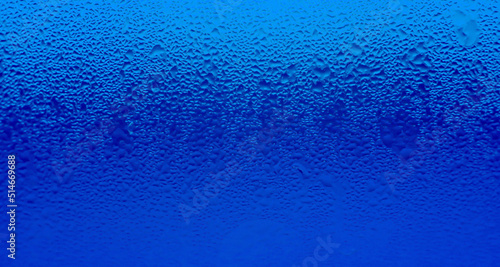 Texture of Water Droplets on Chilled Drink Glass in Gradient Moroccan Blue Color