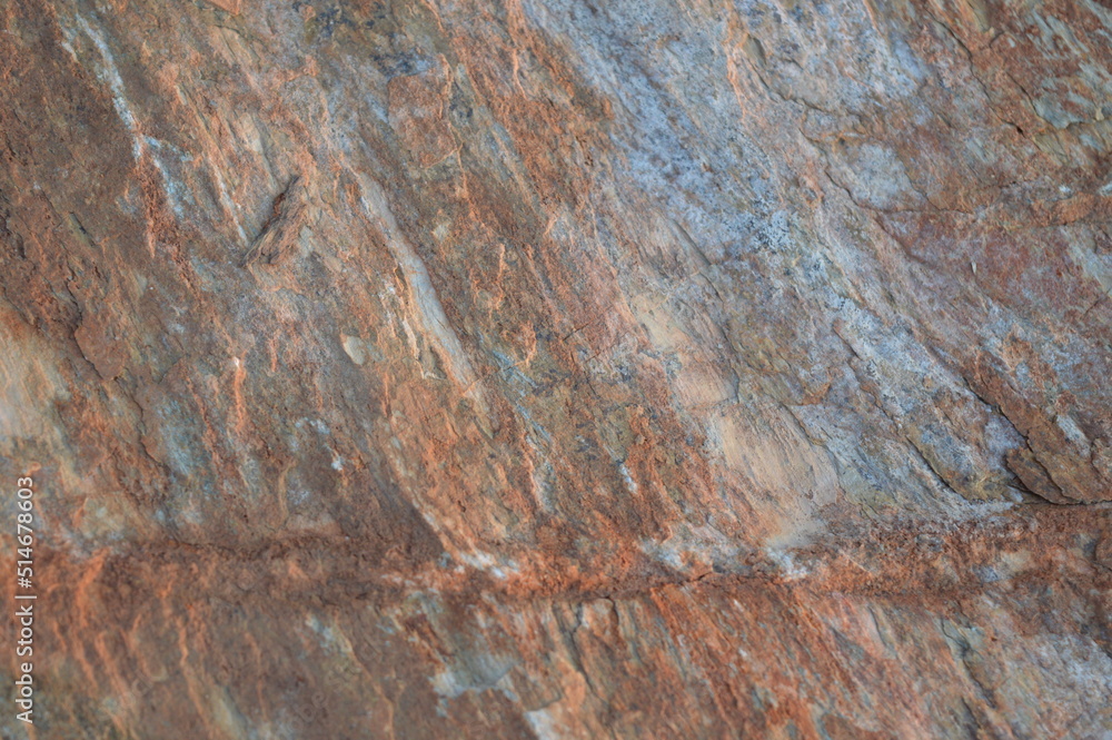 Rough texture of fine natural stone, photographed during golden hour, selective focus Rough texture of fine natural stone, photographed during golden hour, selective focus
