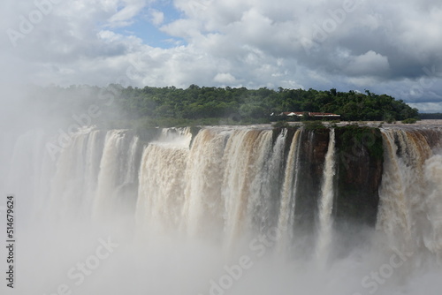 The photo shows a stunning view from the top of the Iguazu Falls — a complex of 275 waterfalls on the Iguazu River, located on the border of Brazil and Argentina